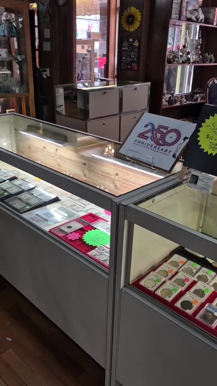 Glass coin showcases inside Main Street Market in Mount Airy, NC